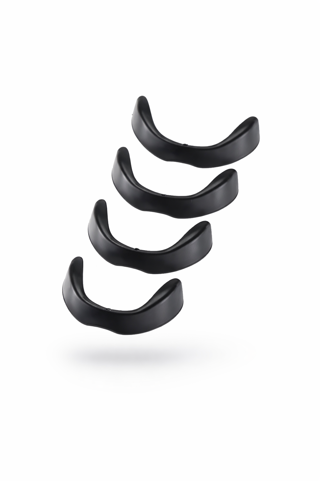 Set of black earbud tips on a white background