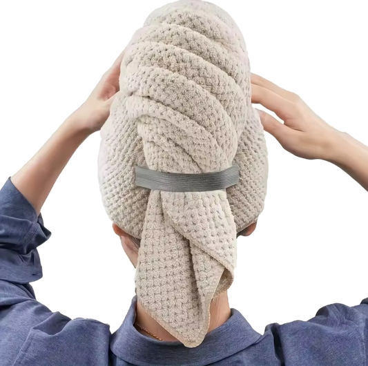 Beige microfiber towel on model's head