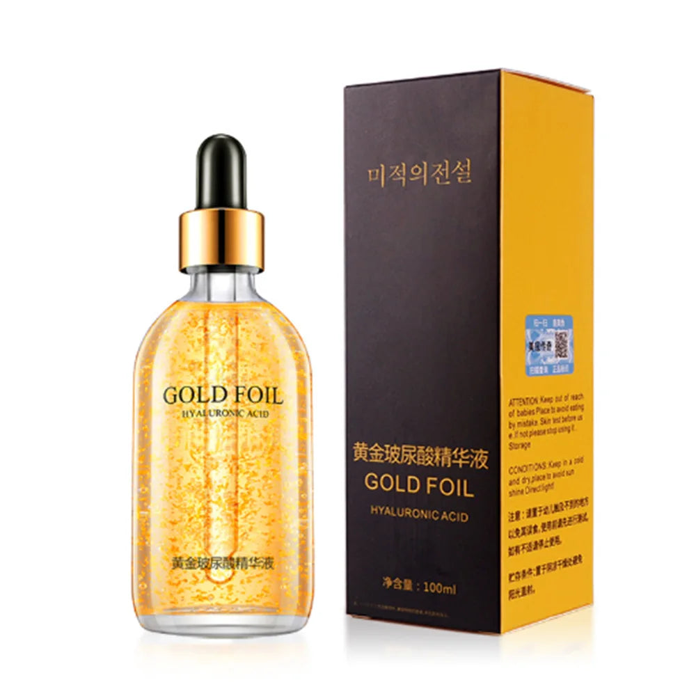 Gold foil serum bottle with packaging on a white background