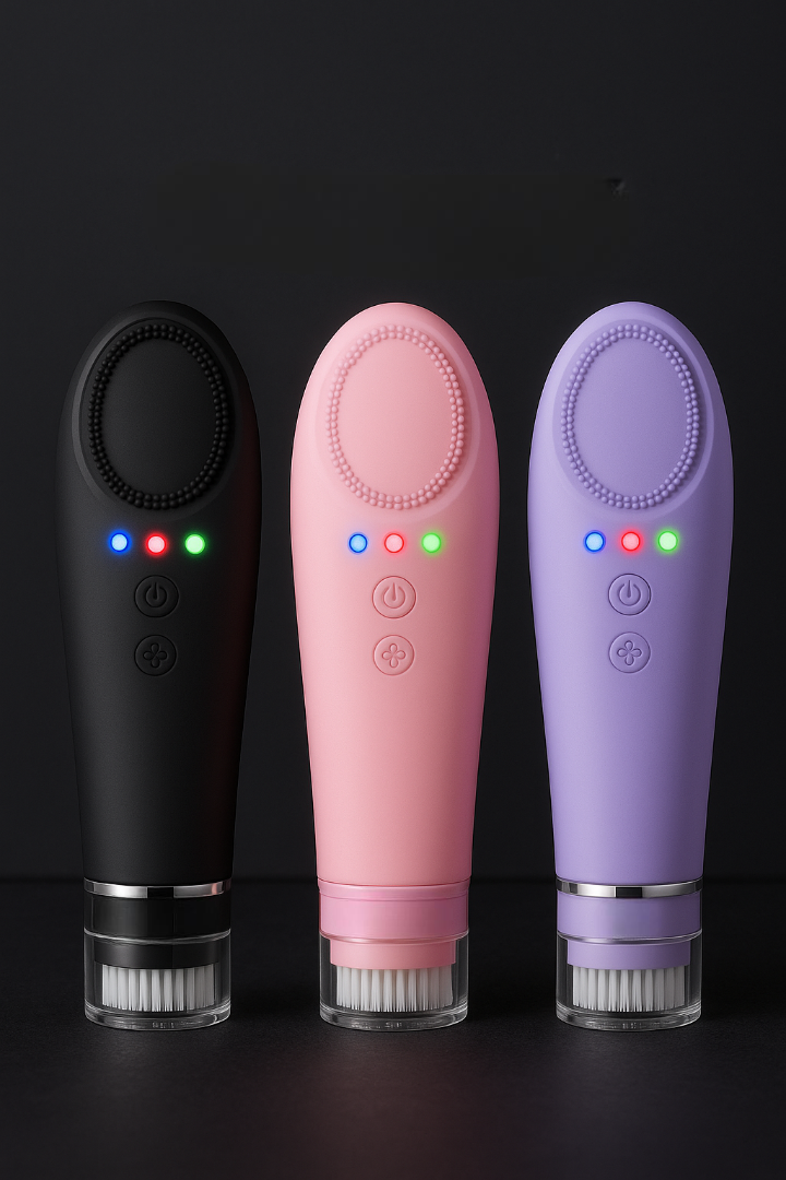 Three electronic devices in black, pink, and purple on a dark background