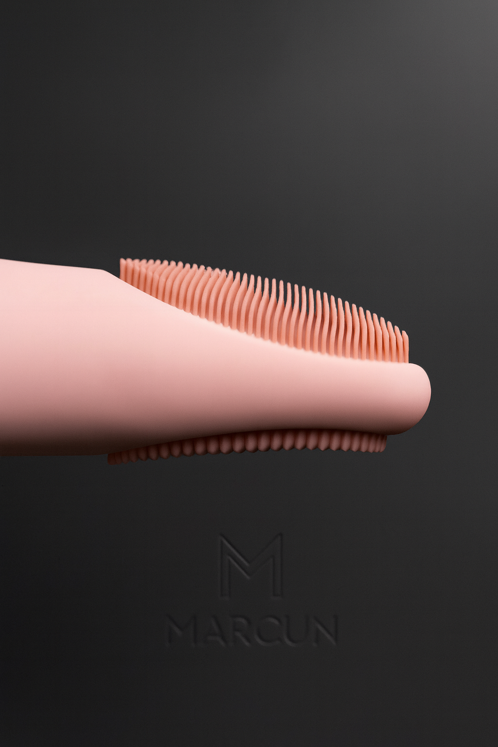 Pink silicone sonic facial cleansing brush with soft bristles and ergonomic handle