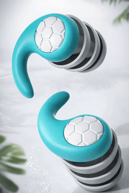 Turquoise and gray fitness tracker on a light background