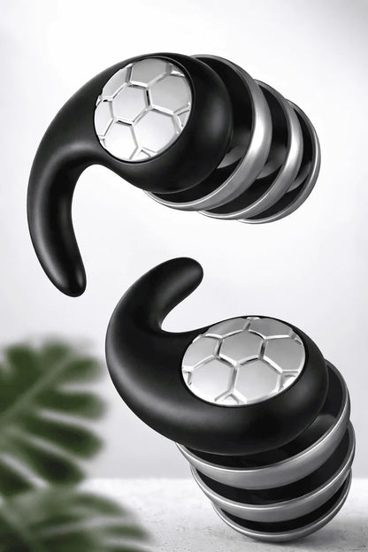 Black and silver earbud headphones on a light gray background