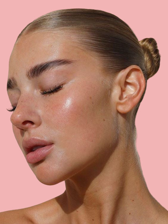 Woman with refreshed glowing skin after removing collagen overnight mask