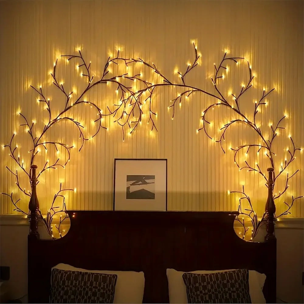Decorative wall lights shaped like branches with warm glow in a room setting.