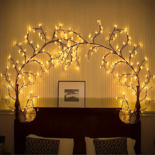 Decorative wall lights shaped like branches with warm glow in a room setting.