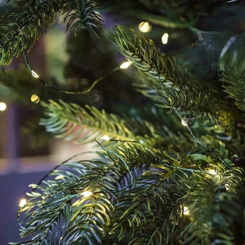 String lights on a Christmas tree with a blurred background