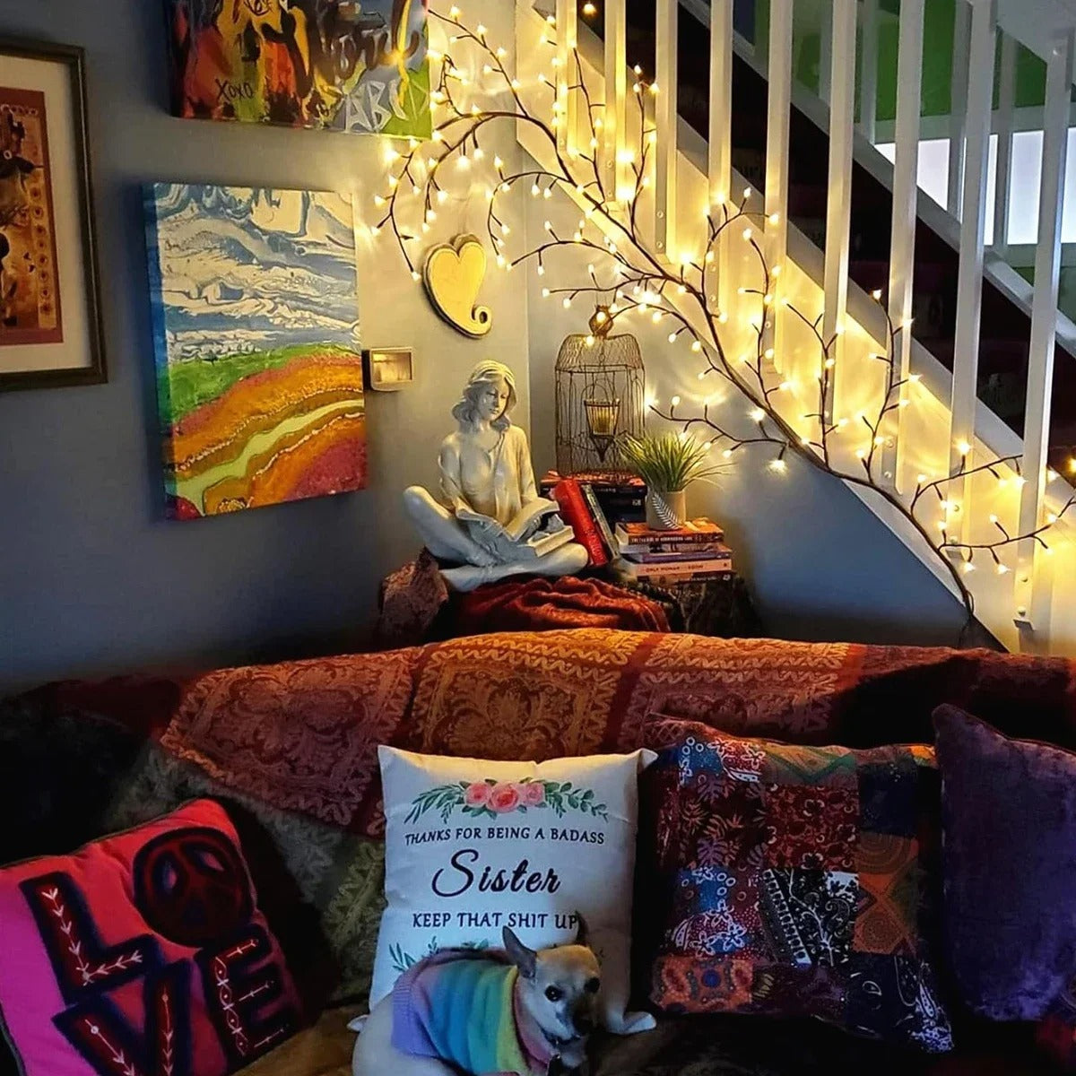 Cozy living room with a couch, decorative pillows, and string lights.