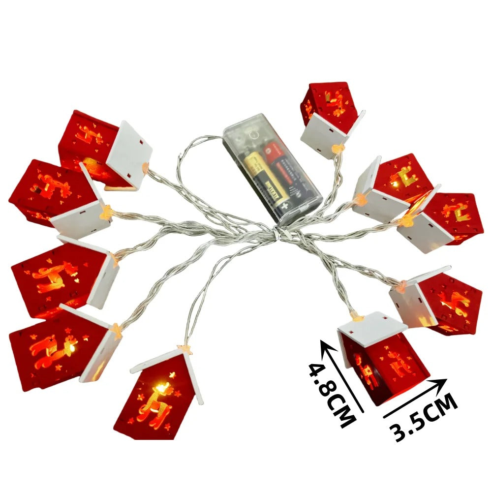 String lights with red and white house-shaped bulbs on a white background