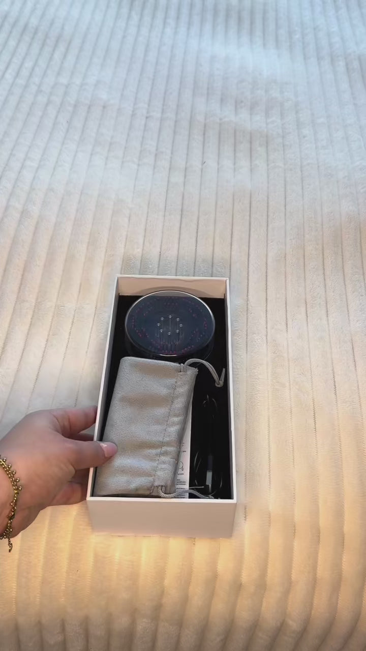 Unboxing video of the Marcun Scalp Spa™ electric LED scalp massager comb, showing the retail box, included accessories and a first look at the soft silicone teeth and handle.